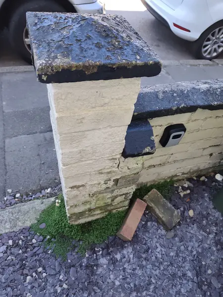 Cecil Street, Watford — weathered garden wall pillar before restoration
