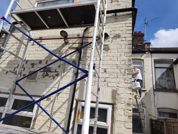 Cecil Street, Watford — scaffolding tower on side elevation during exterior painting