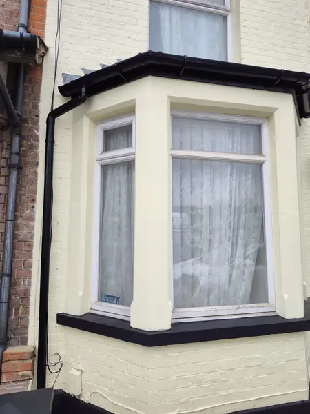 Cecil Street, Watford — finished bay window detail, sharp cream brick and black gutters