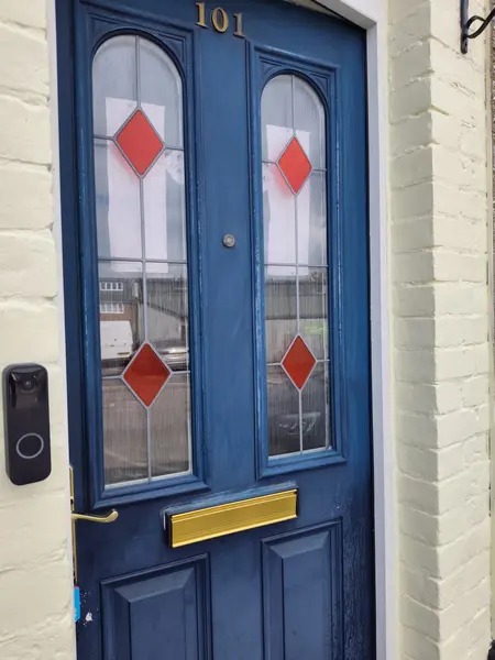 Cecil Street, Watford — blue front door, freshly painted white brick surround