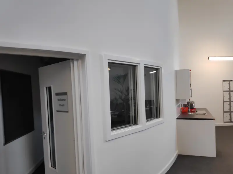 Milton Keynes Academy, Milton Keynes — reception and corridor with crisp white walls and clean lines